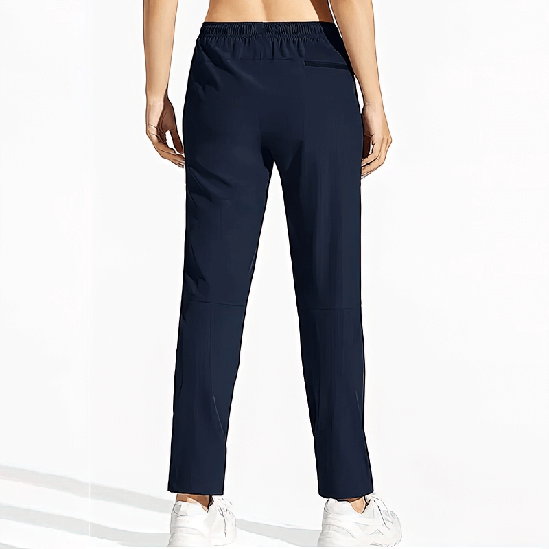 Back view of women's waterproof quick-drying hiking pants with elastic waist, navy color, SF1213 model, showing comfort fit.